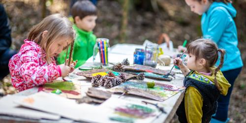 Group of children doing painting outside