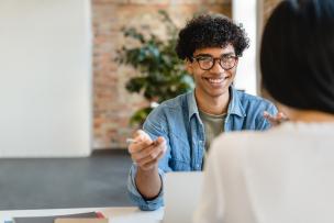 Happy and engaged Educator being interviewed by another